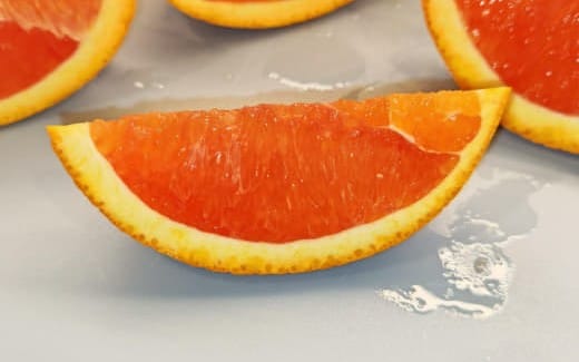 Close-up of orange citrus slices on a light surface for a mixed photography collection product