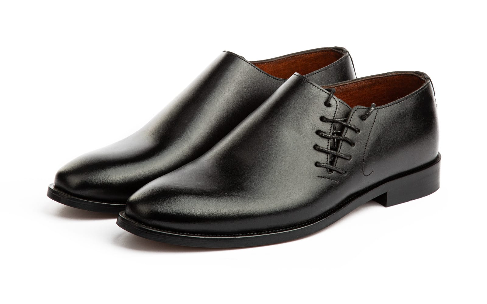 Pair of black leather lace-up dress shoes with rubber soles, shown side by side on a white background