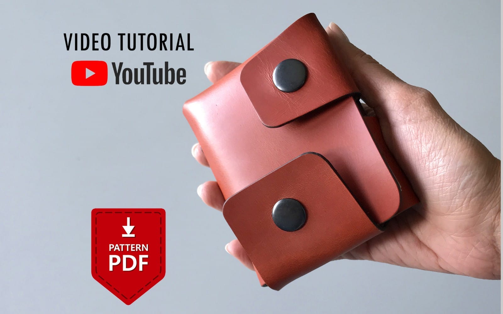 Hand holding a brown leather origami card wallet with snap closure, selling pattern PDF file