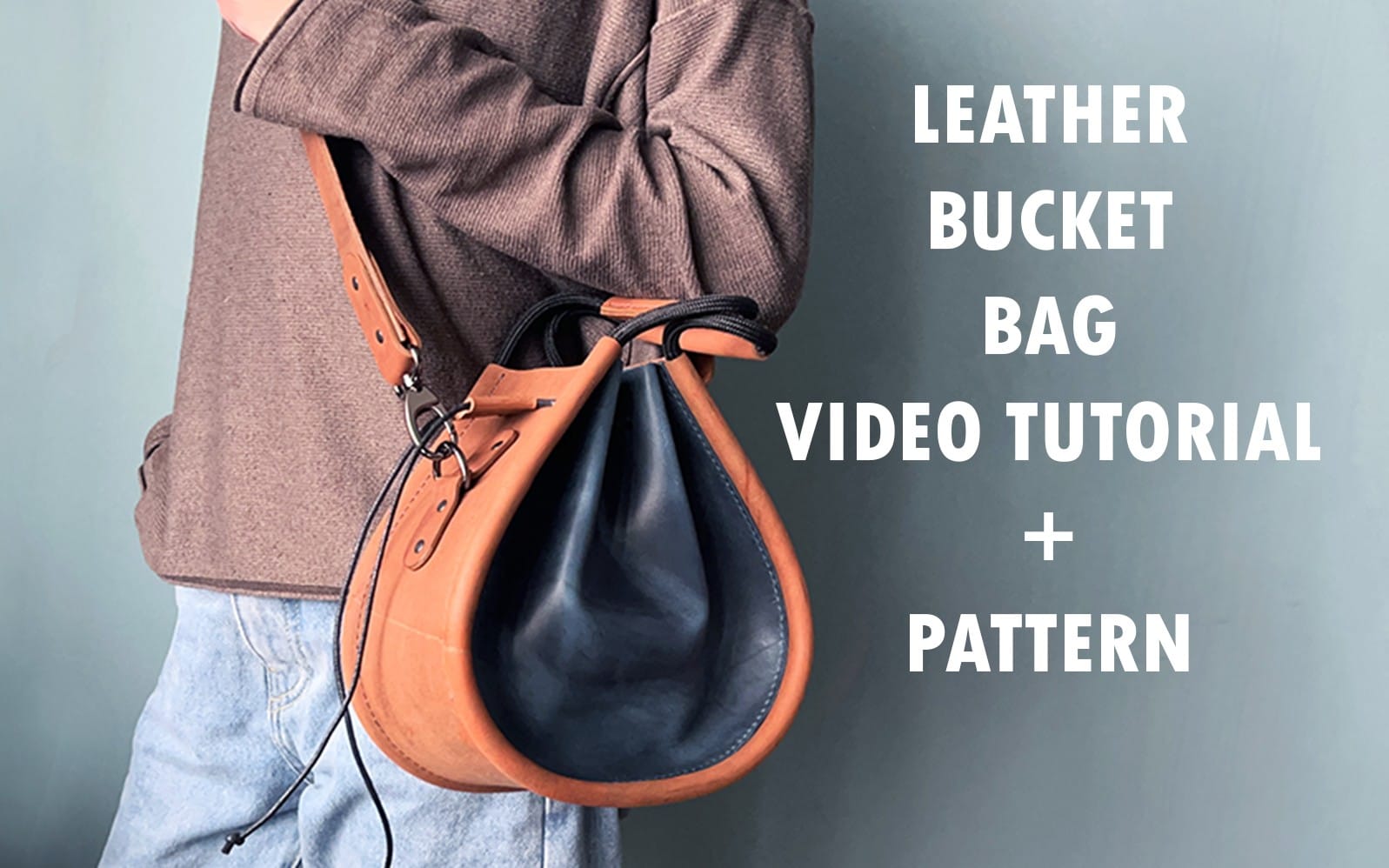 Leather small bucket bag pattern PDF with video tutorial text over a model holding a drawstring bucket bag