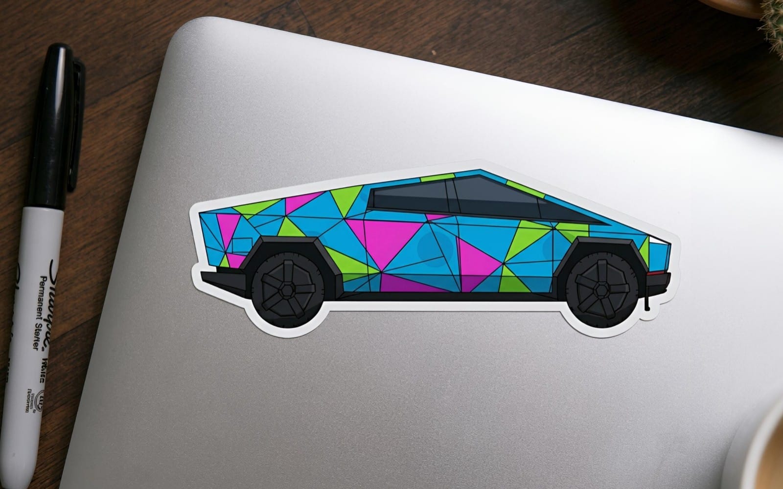 Neon cybertruck digital art sticker featuring colorful geometric polygon pattern on a futuristic pickup truck
