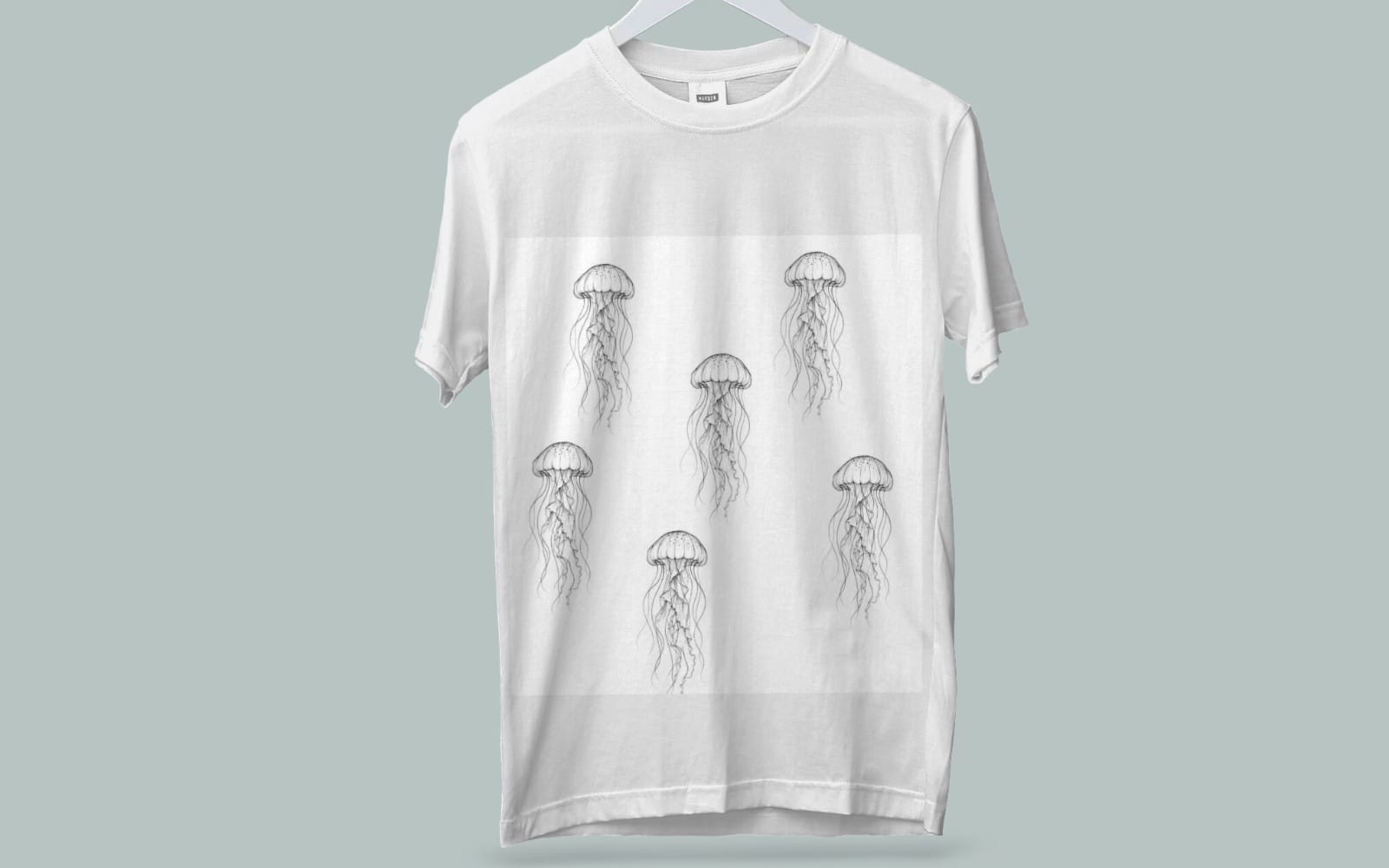 White T-shirt mockup with minimalist jellyfish line art pattern in black ink design