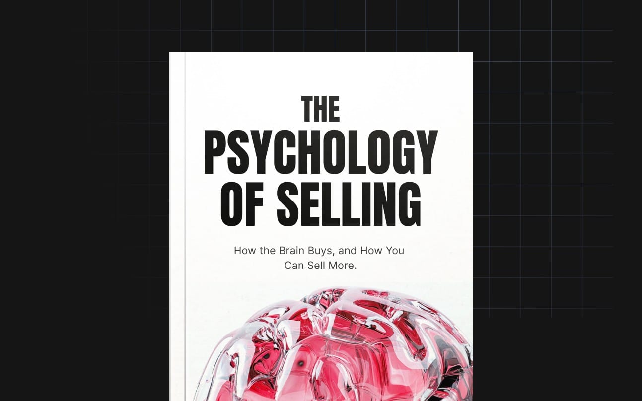 Cover of The Psychology of Selling book with bold title text and a red glass-like brain graphic on black grid background