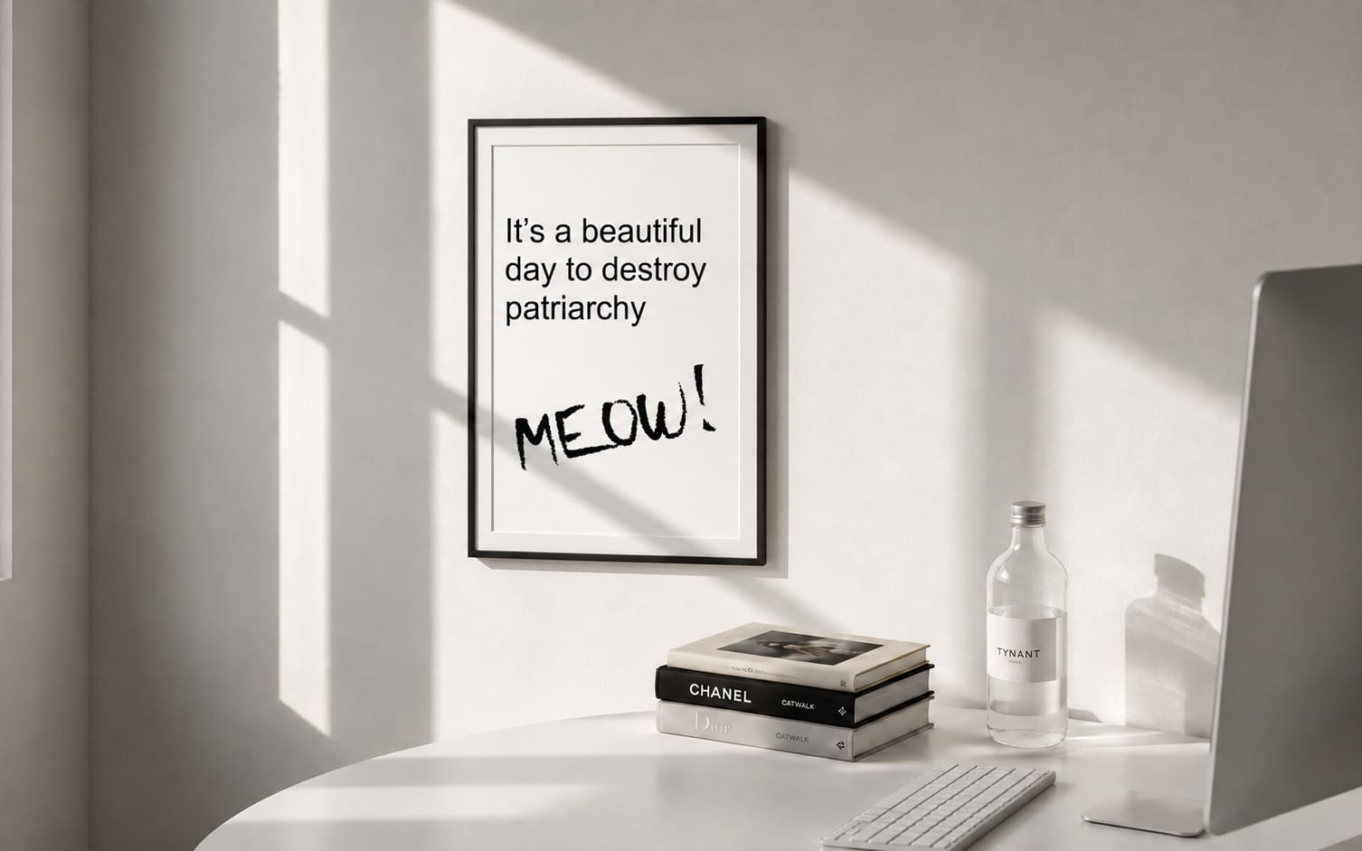 Framed feminist cat quote poster reading It’s a beautiful day to destroy patriarchy MEOW on a wall desk setting