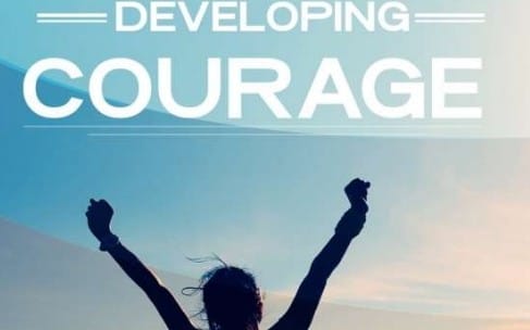 Developing Courage motivational digital cover featuring raised arms silhouette against a sky background