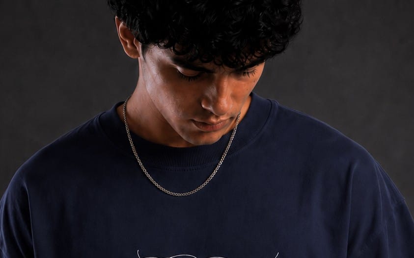 Model wearing a dark blue Bongzi graphic t-shirt in a studio portrait
